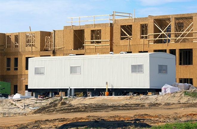 construction workers discussing plans in a rental office in Lucasville OH